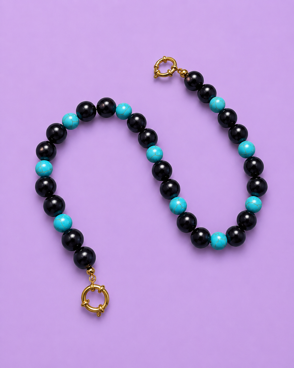 Trouble in turquoise: obsidian & turquoise stone bag charm