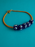 Eye contact: resin evil eyes & orange Czech beads